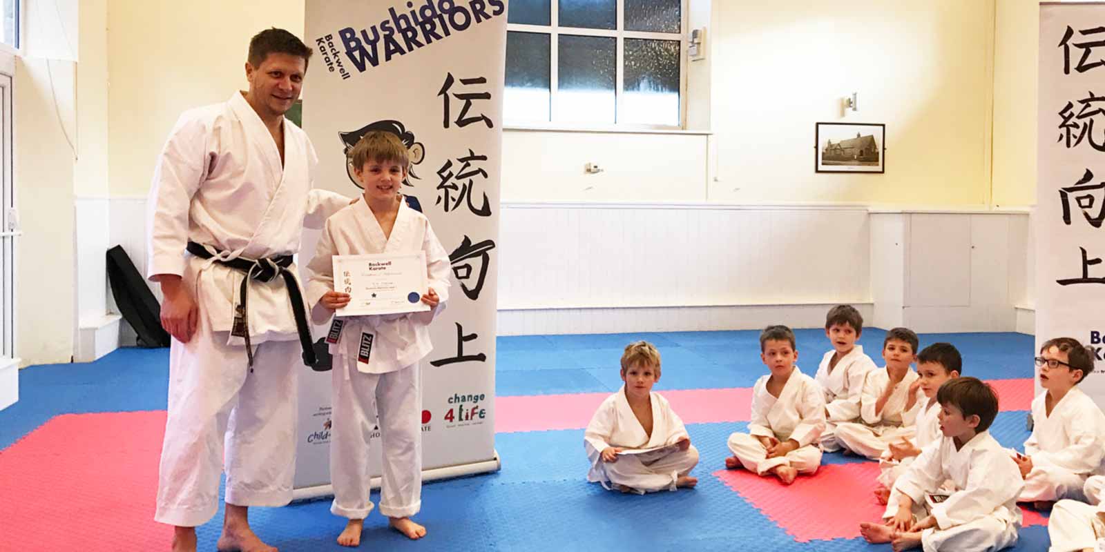 Sensei Dan Salter presenting certificates after another 12 week Bushido Warriors course